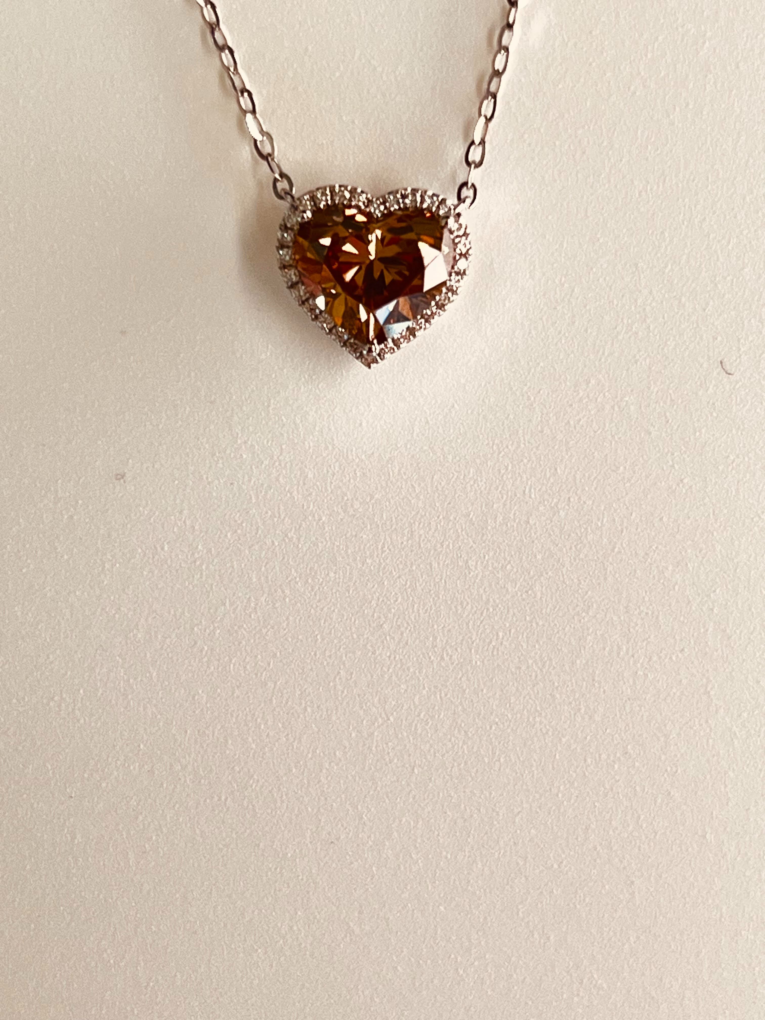 18K White Gold Heart Necklace Featuring a .85ct Fancy Brown Diamond with .07ctw White Diamond Accents