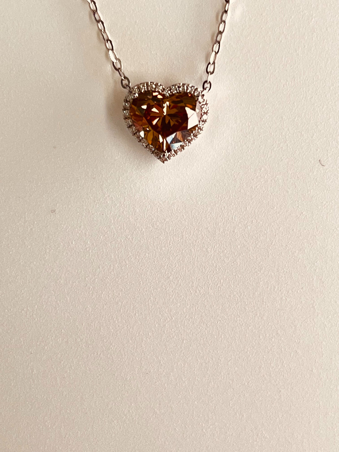 18K White Gold Heart Necklace Featuring a .85ct Fancy Brown Diamond with .07ctw White Diamond Accents