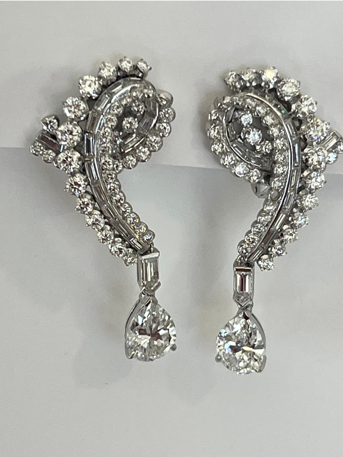 Diamond Earrings Featuring a 2.03ct GIA-Certified E VS1 Pear-Shaped Diamond, a 2.11ct GIA-Certified E VS1 Pear-Shaped Diamond, 4.34ctw Round Diamonds, .61ctw Baguette Diamonds, and .60ctw Bullet-Shaped Diamonds (Convertible Non-Pierced)