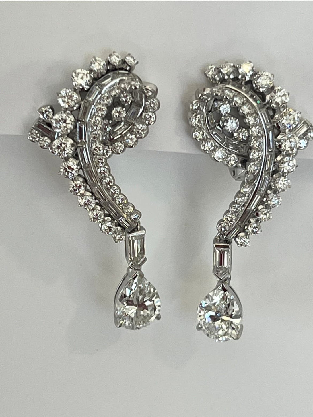 Diamond Earrings Featuring a 2.03ct GIA-Certified E VS1 Pear-Shaped Diamond, a 2.11ct GIA-Certified E VS1 Pear-Shaped Diamond, 4.34ctw Round Diamonds, .61ctw Baguette Diamonds, and .60ctw Bullet-Shaped Diamonds (Convertible Non-Pierced)