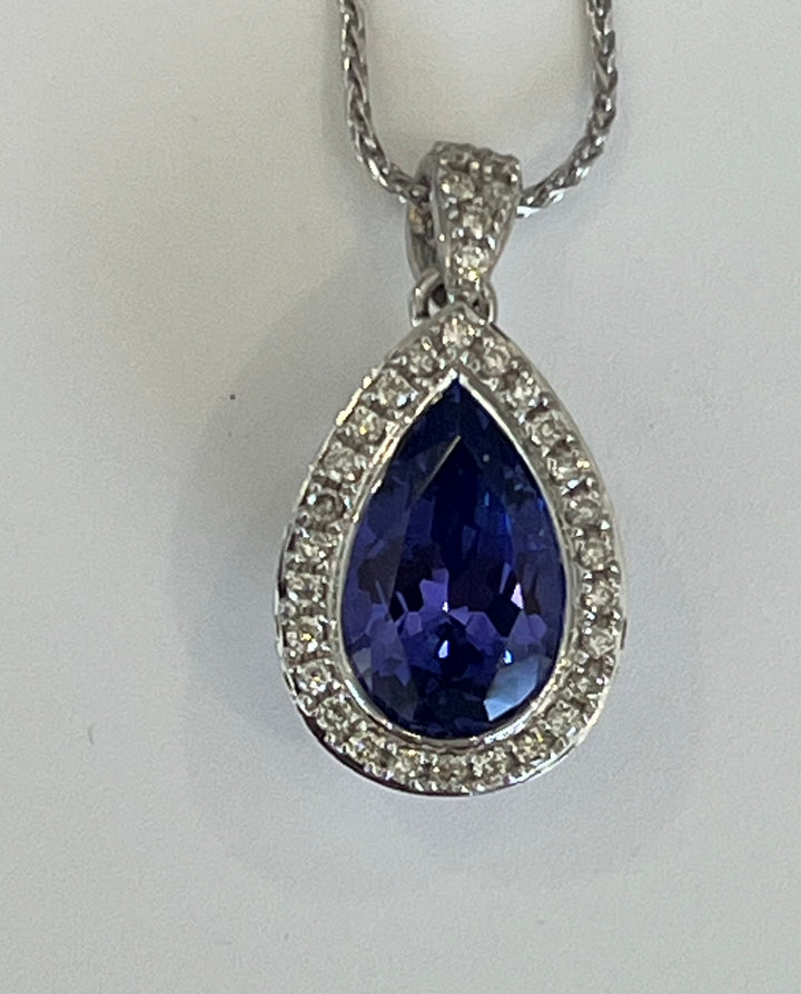 18K White Gold Pendant Featuring a 3.06ct Tanzanite with .19ctw Diamond Accents