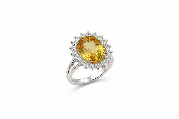 Ring with a yellow gemstone and diamond accents 
