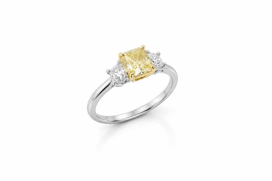 Platinum and 18K Yellow Gold Ring Featuring a 1.39ct GIA-Certified Fancy Light Yellow I1 Radiant-Cut Diamond with .39ctw Princess-Cut Diamond Accents
