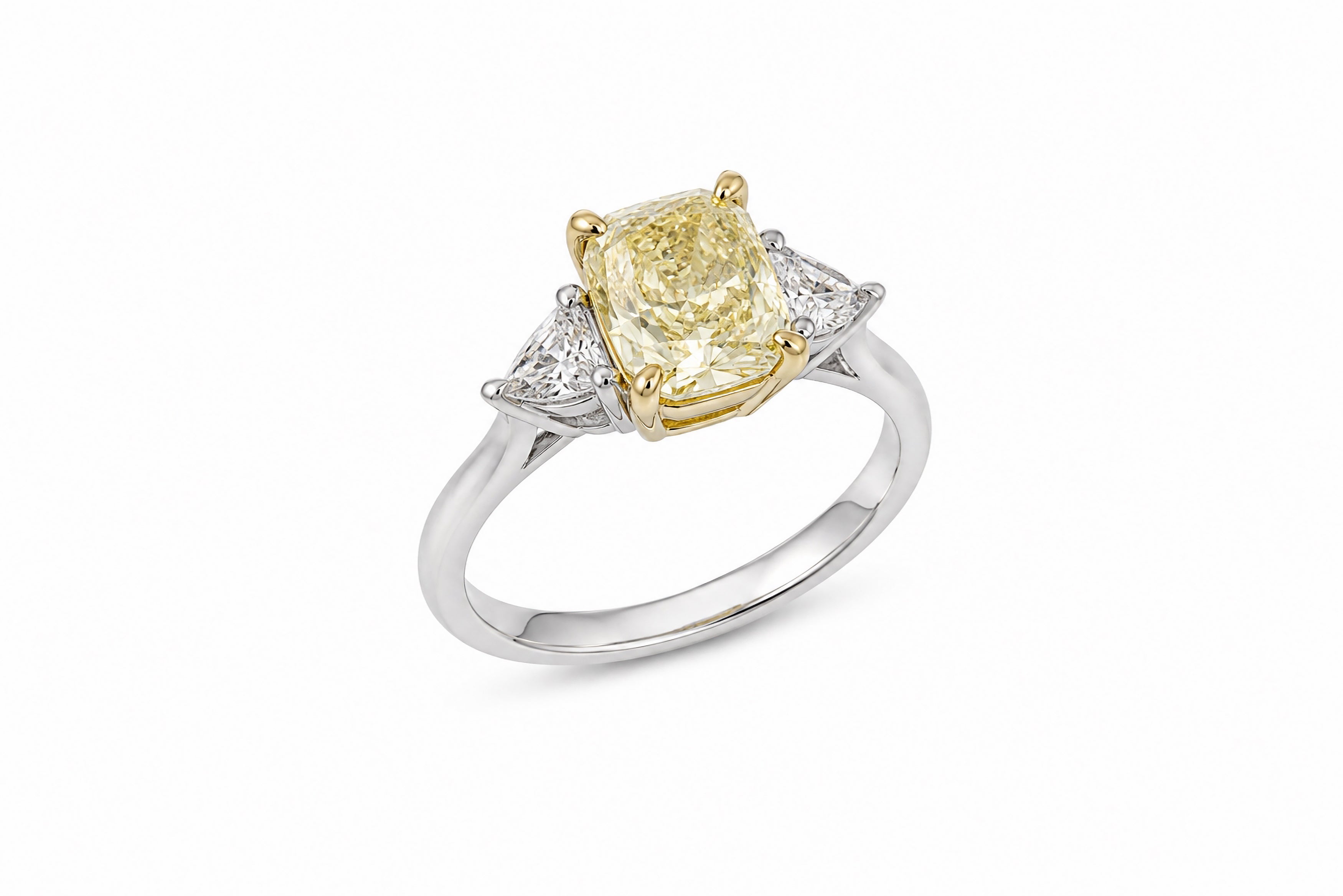 Platinum and 18K Yellow Gold Three-Stone Ring Featuring a 1.62ct GIA-Certified Fancy Light Yellow Cushion-Cut Diamond with .36ctw Trilliant-Cut Diamond Accents