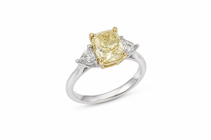 Platinum and 18K Yellow Gold Three-Stone Ring Featuring a 1.62ct GIA-Certified Fancy Light Yellow Cushion-Cut Diamond with .36ctw Trilliant-Cut Diamond Accents