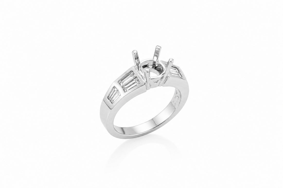 Elegant 18K white gold diamond mounting featuring .60 CTW baguette diamonds and a six-prong center setting. Perfect for a custom engagement ring.