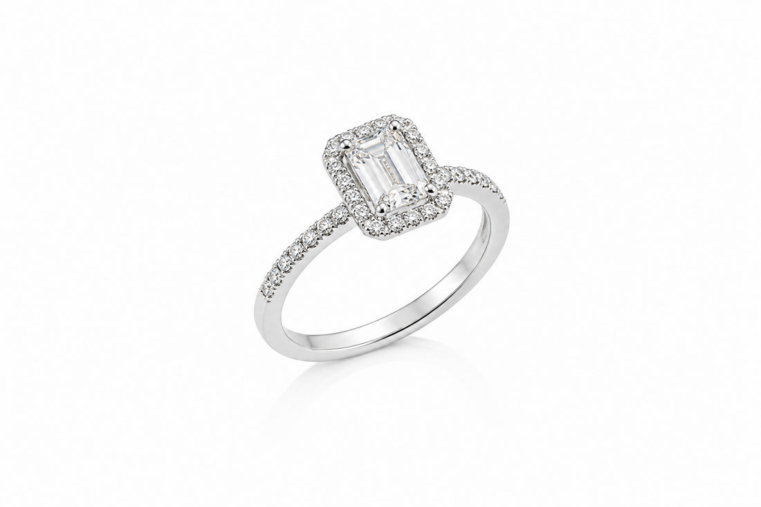 14K White Gold Halo Ring Featuring a 1.00ct H SI2 Emerald-Cut Diamond with .26ctw Diamond Accents engagement