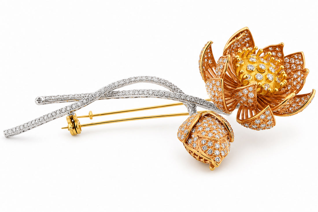 Gold and silver floral brooches with diamond accents on a white background 18K White, Yellow, and Rose Gold Diamond Brooch Featuring 4.50ctw Diamonds, 4" Long flower lapel