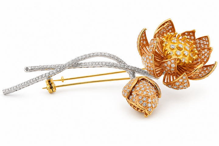 Gold and silver floral brooches with diamond accents on a white background 18K White, Yellow, and Rose Gold Diamond Brooch Featuring 4.50ctw Diamonds, 4" Long flower lapel