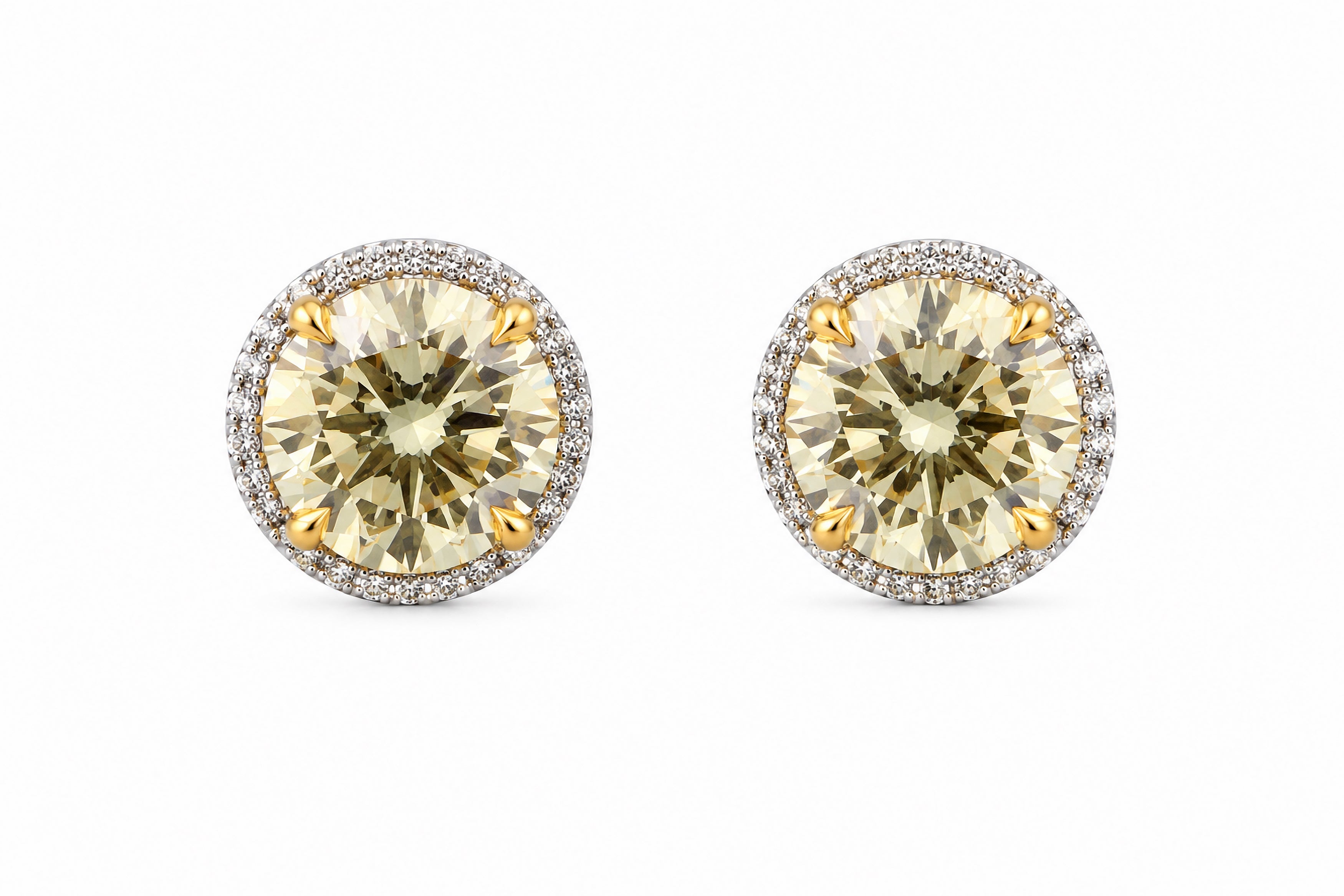 Pair of round yellow gemstone earrings with silver halos on a white background. 14K Gold Diamond Earrings Featuring a 2.09ct GIA-Certified Fancy Yellow VS2 Round Brilliant Diamond, a 2.01ct Fancy Yellow SI2 Round Brilliant Diamond, and .23ctw White Diamonds