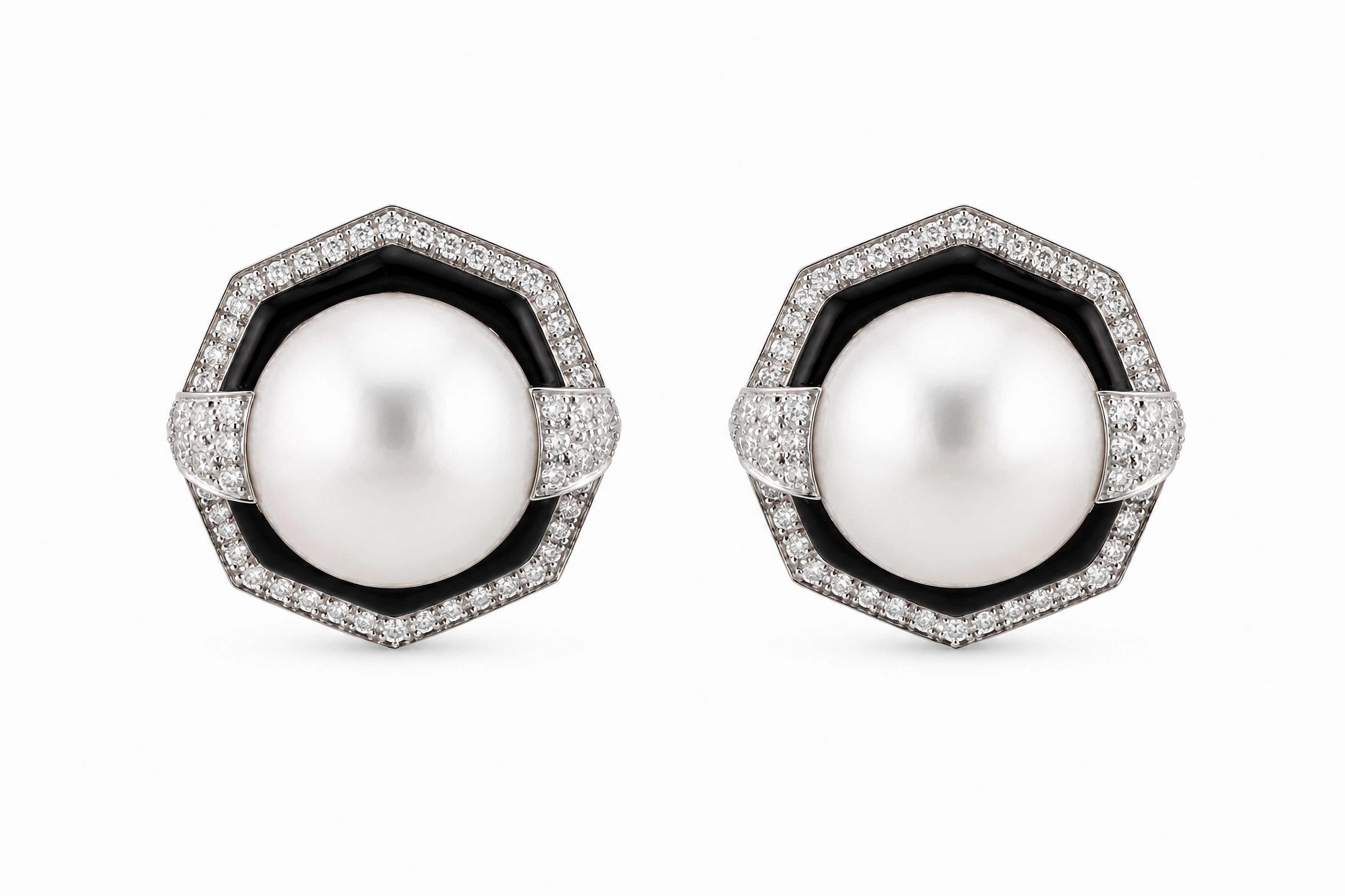 Pair of pearl earrings with black and white accents on a white background. David Webb
